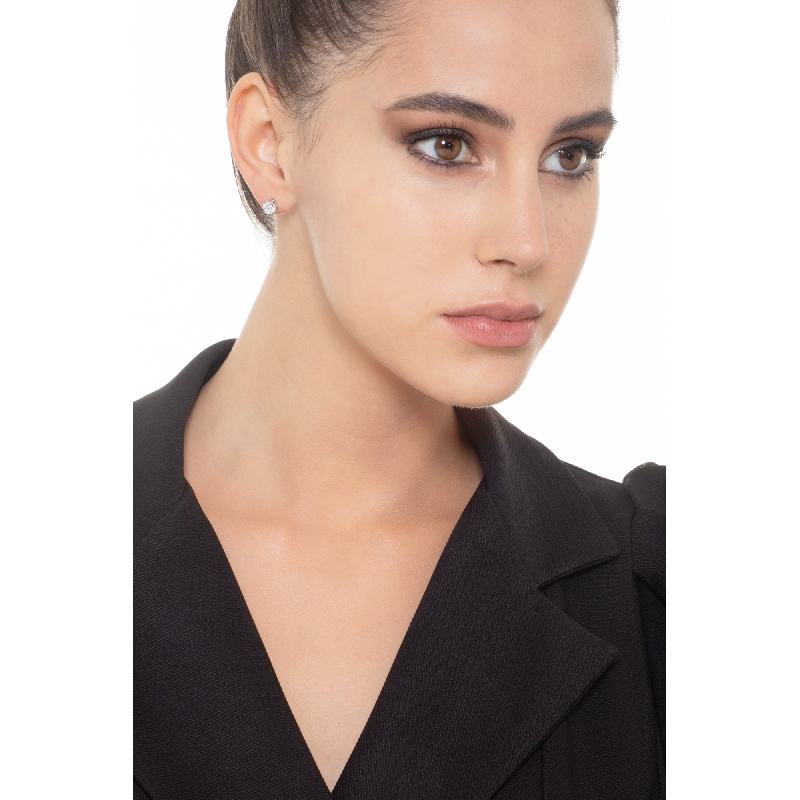 Orecchini punto luce in oro bianco 18k a castone con diamanti.