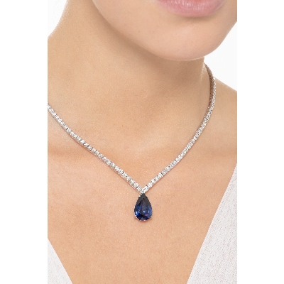 Gradueted tennis chain in 18k white gold with a big  pear cut blue sapphire and diamonds