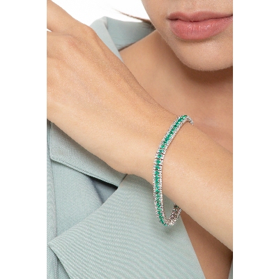 Fancy tennis bracelet with diamonds and emeralds