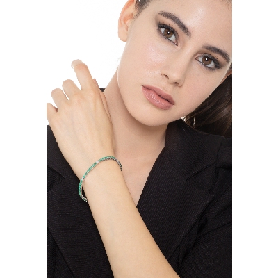 Emerald and diamond tennis bracelet in 18k white gold