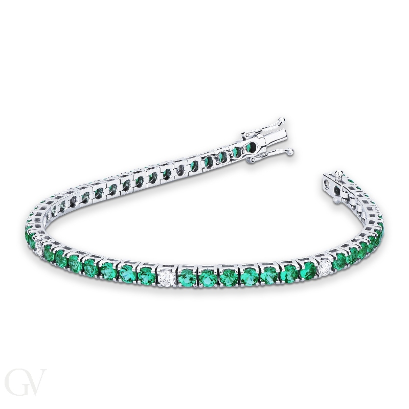 Emerald and diamond tennis bracelet in 18k white gold