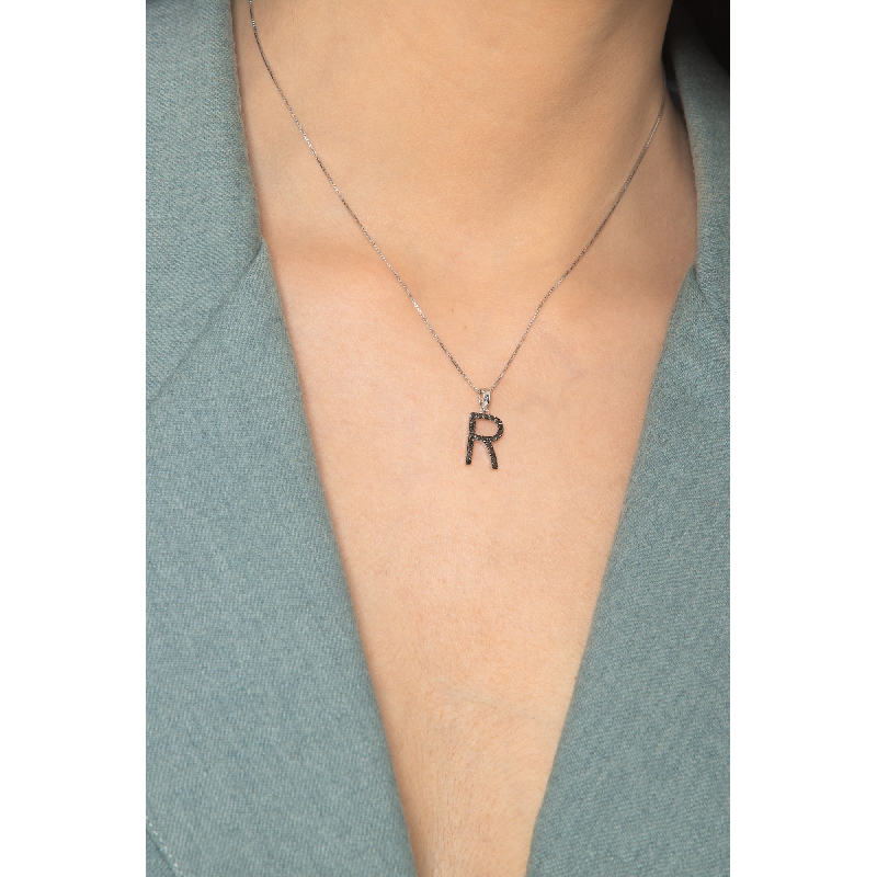 18k white gold letter R with black diamonds