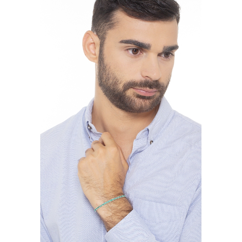 Pyramid links tennis bracelet with emeralds