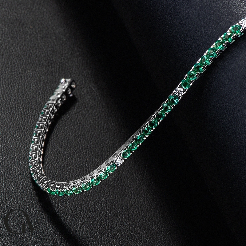 Square links tennis bracelet with emeralds and round cut diamonds