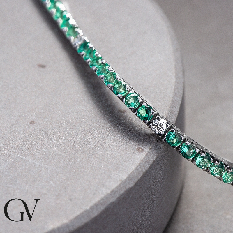 Wire tennis bracelet with emeralds and diamonds