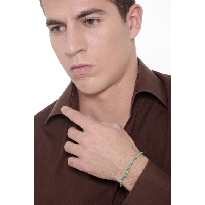 Wire tennis bracelet with emeralds and diamonds