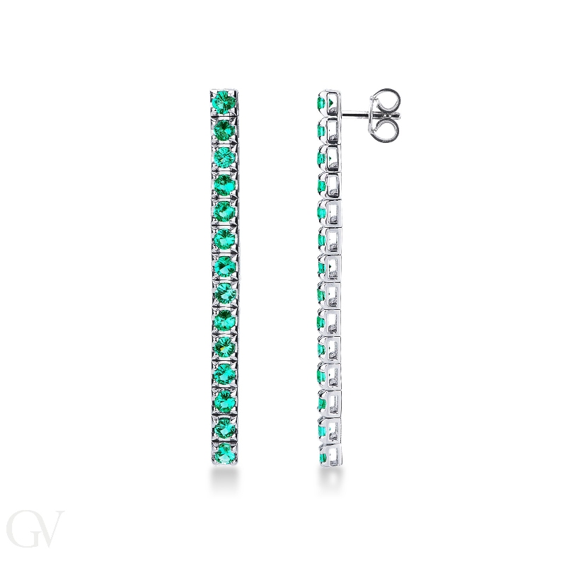 Drop tennis earrings with emeralds in 18k white gold