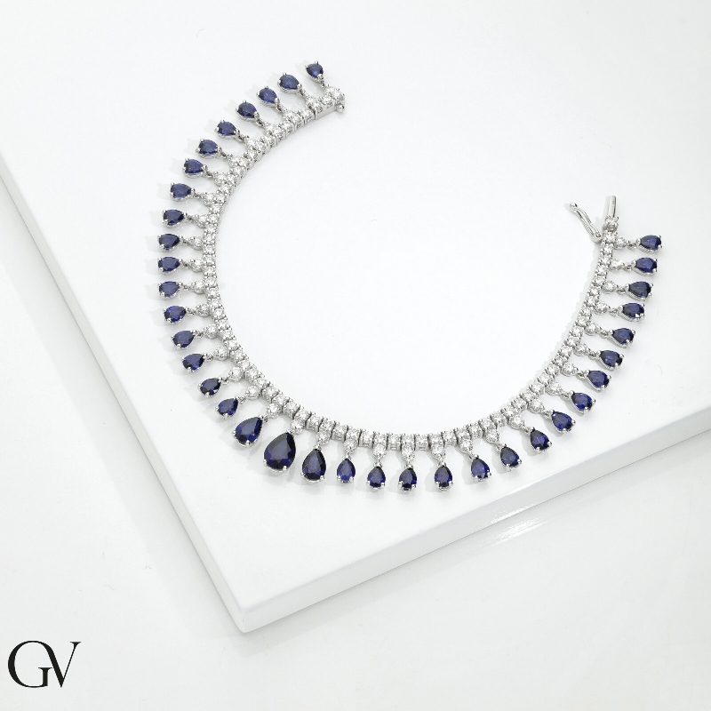 Bracciale tennis design in oro bianco 750 con zaffiri blu e diamanti