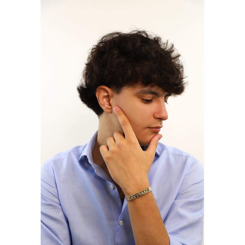 Bracciale in oro giallo con maglia lucida e, al centro, maglia groumette