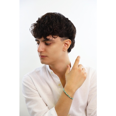 Emerald and diamond tennis bracelet in 18k white gold