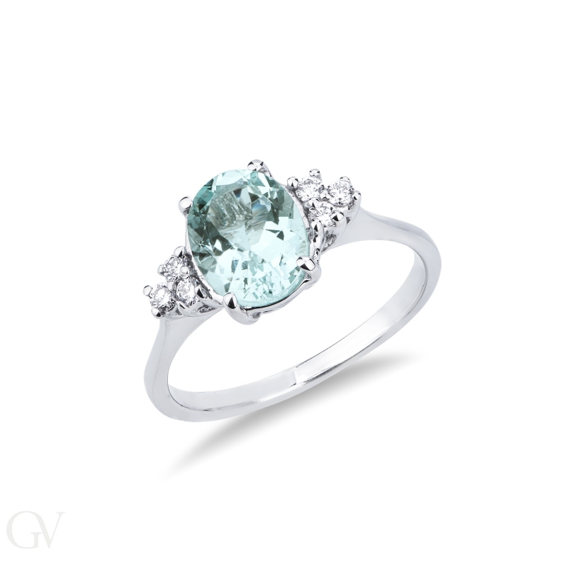 White gold 18k ring with aquamarine and three diamonds each side