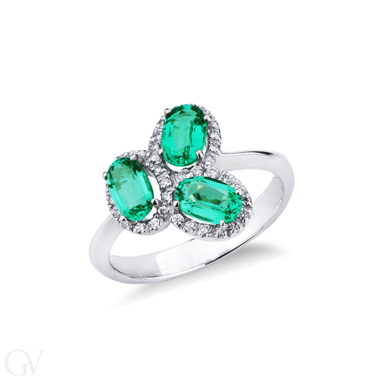 White gold 18k ring with three oval cut emeralds and halo diamonds 