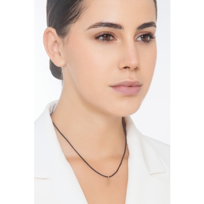 Ciondolo con lettera iniziale Q corsivo in oro giallo 18k