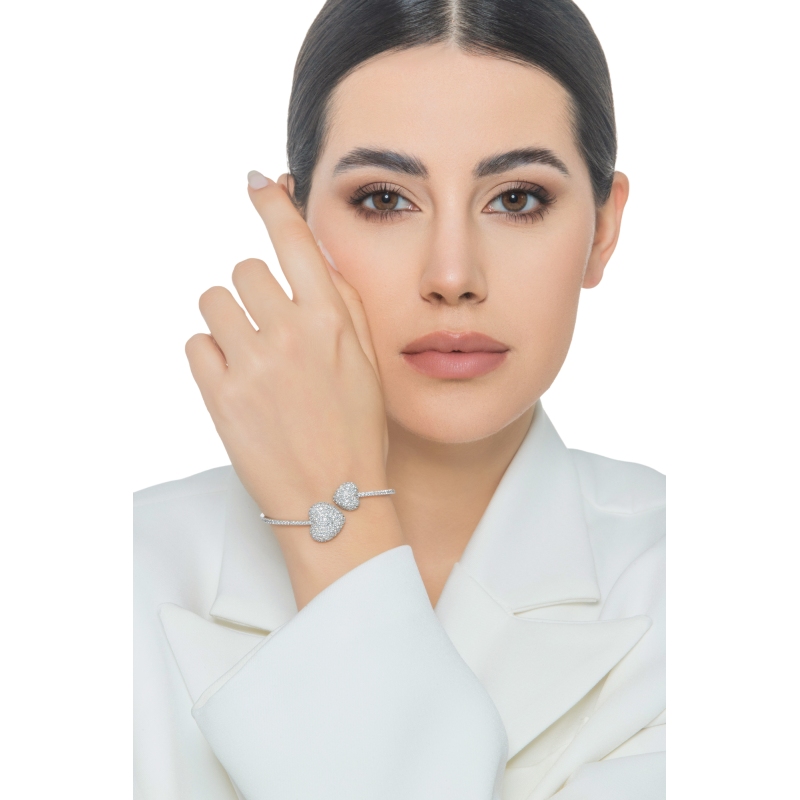 Bracciale in oro bianco 18k con due cuori in diamanti