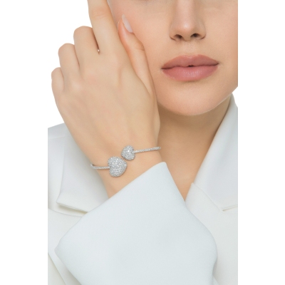 Bracciale in oro bianco 18k con due cuori in diamanti