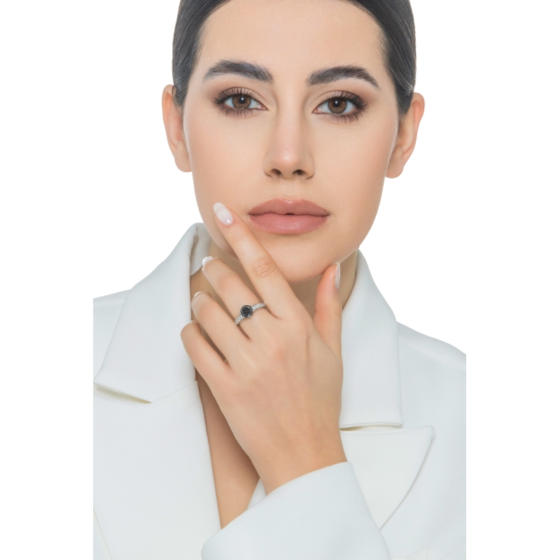 6 claw solitaire ring with a central black diamond and white diamonds shoulder set