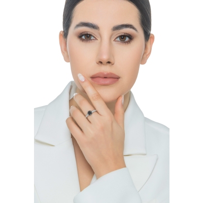 6 claw solitaire ring with a central black diamond and white diamonds shoulder set