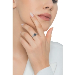 6 claw solitaire ring with a central black diamond and white diamonds shoulder set 2