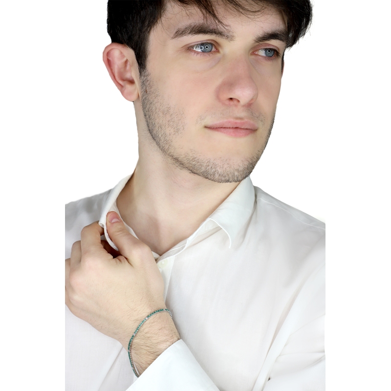 Wire links tennis bracelet with emeralds and diamonds