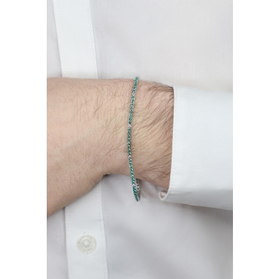 Wire links tennis bracelet with emeralds and diamonds