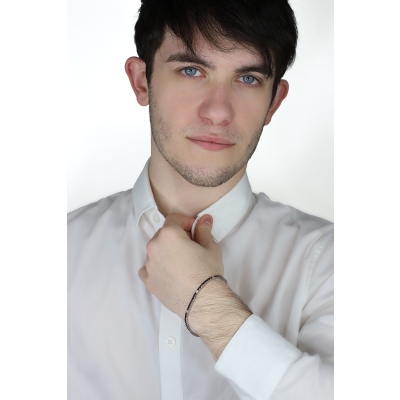 18k white gold tennis bracelet with black and white diamonds and burnished tips