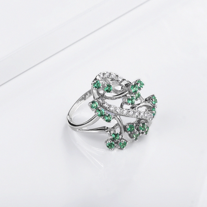 White gold 18k ring with diamonds and emeralds