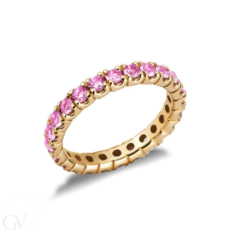 18k yellow gold eternity ring with pink sapphires