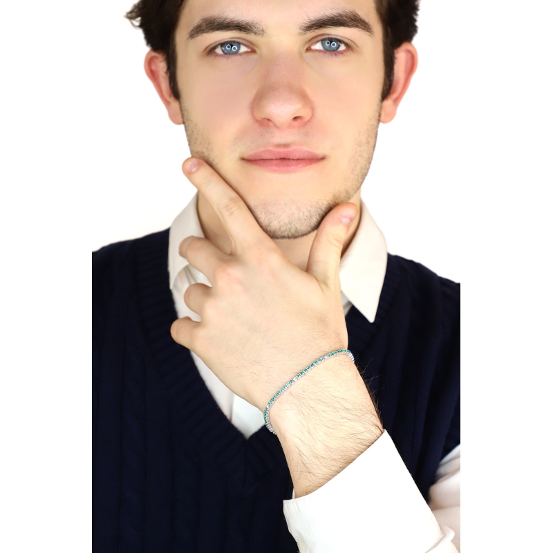 Wire style tennis bracelet with emeralds and diamonds