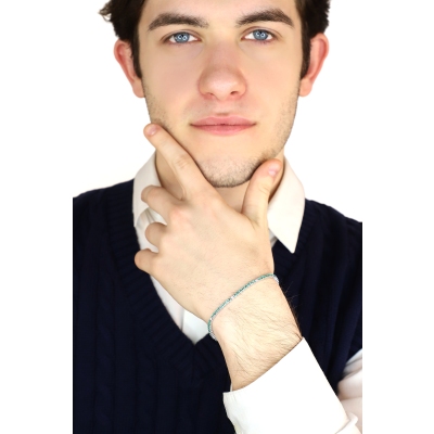 Wire style tennis bracelet with emeralds and diamonds