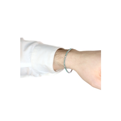 Wire style tennis bracelet with emeralds and diamonds