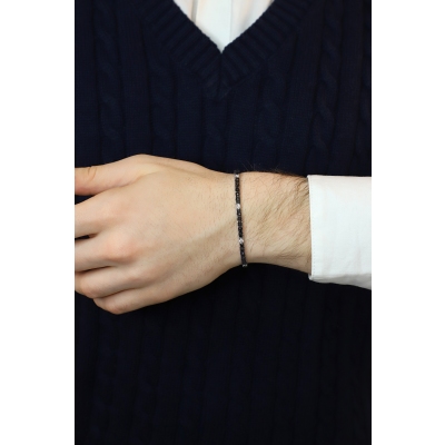 Pyramid top tennis bracelet with black and white round cut diamonds