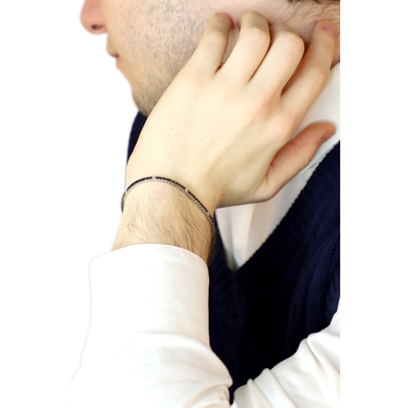 18k white gold tennis bracelet with black and white diamonds and burnished tips