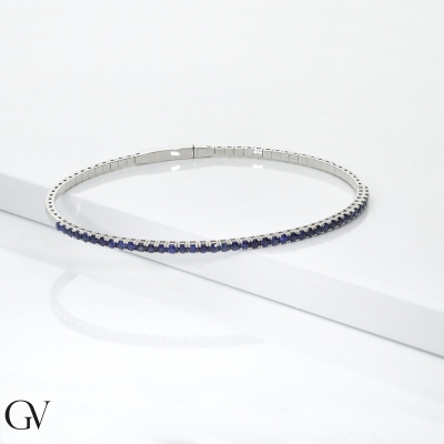 Bracciale rigido tennis con zaffiri blu in oro bianco 18k