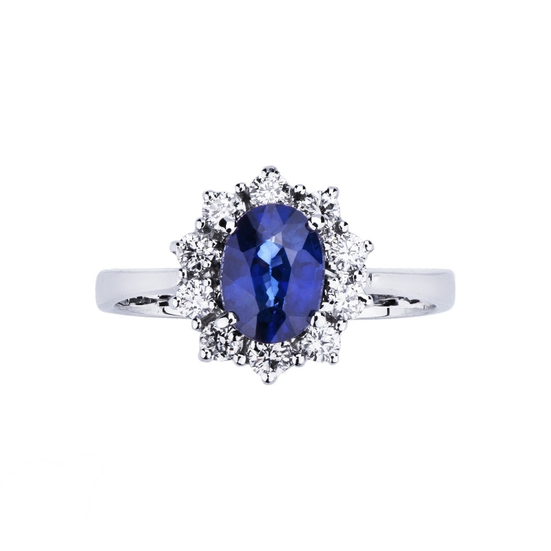 Halo ring with a central blue sapphire and diamonds in white gold 18k