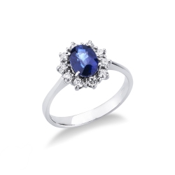 Halo ring with a central blue sapphire and diamonds in white gold 18k