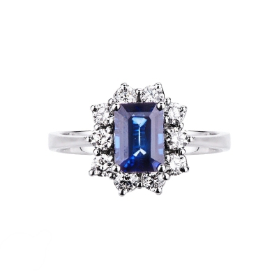White gold 18k halo ring with diamonds and central blue sapphire 