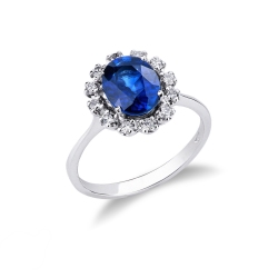18k white gold halo ring with diamonds and a blue sapphire oval cut 