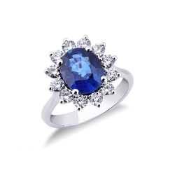 White gold 18k ring with twelve halo diamonds and a central blue sapphire