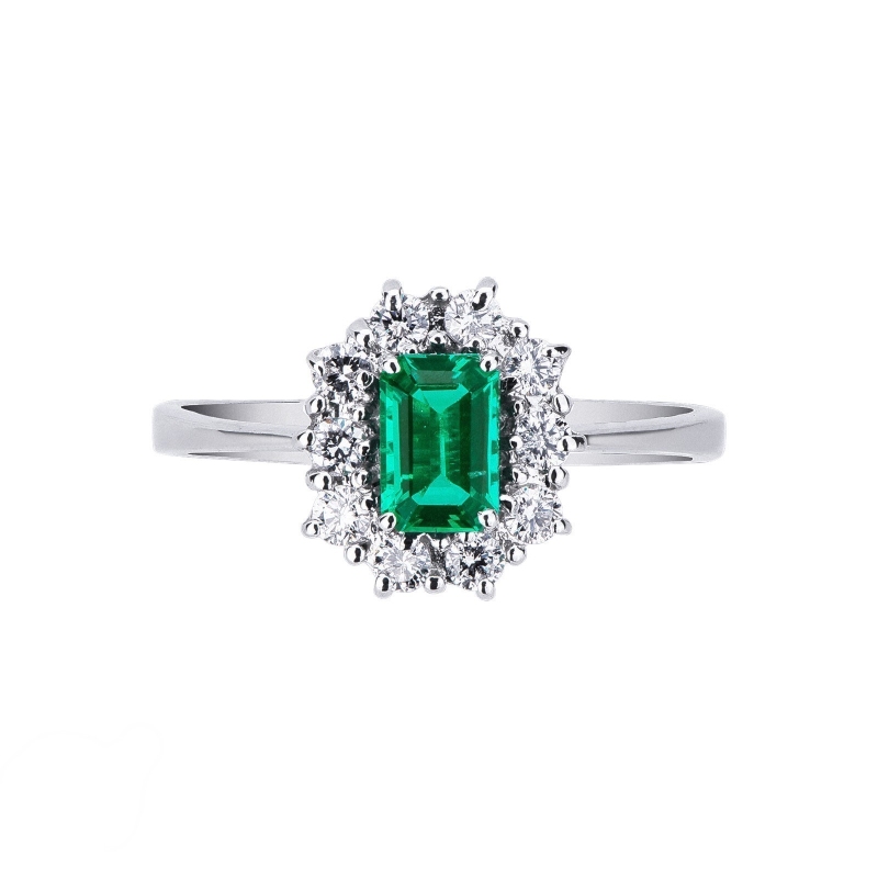 White gold 18k halo ring with a central emerald and diamonds 