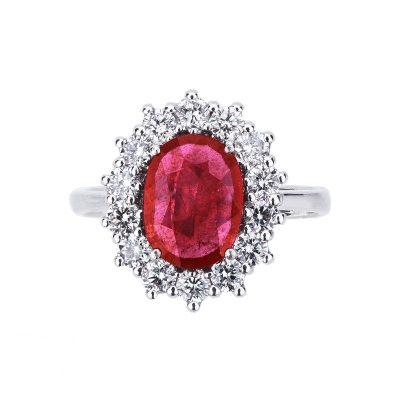 Halo ring with central ruby oval cut and diamonds white gold 18k