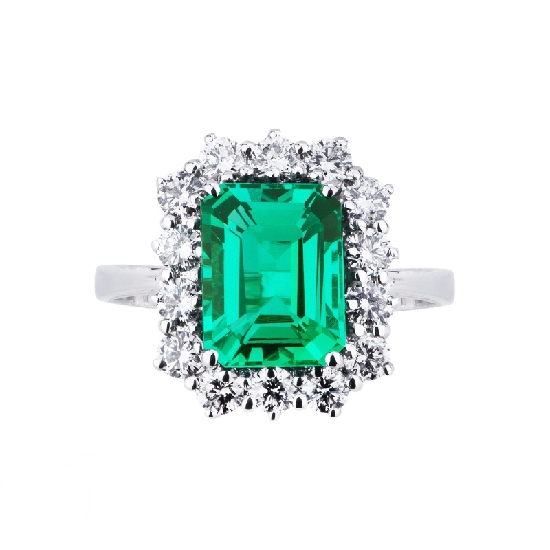 White gold 18k halo ring with diamonds and emerald 