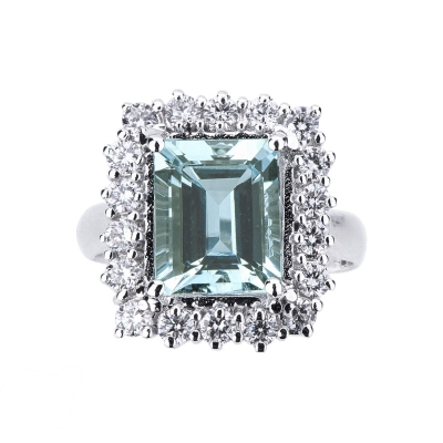 White gold 18k halo ring with diamonds and central aquamarine emerald cut 