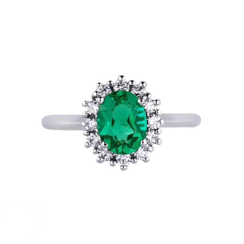 Halo ring with diamonds and central emerald in white gold 18k