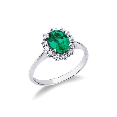 Halo ring with diamonds and central emerald in white gold 18k
