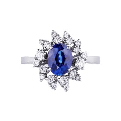 White gold 18k diamond halo ring with a central blue sapphire