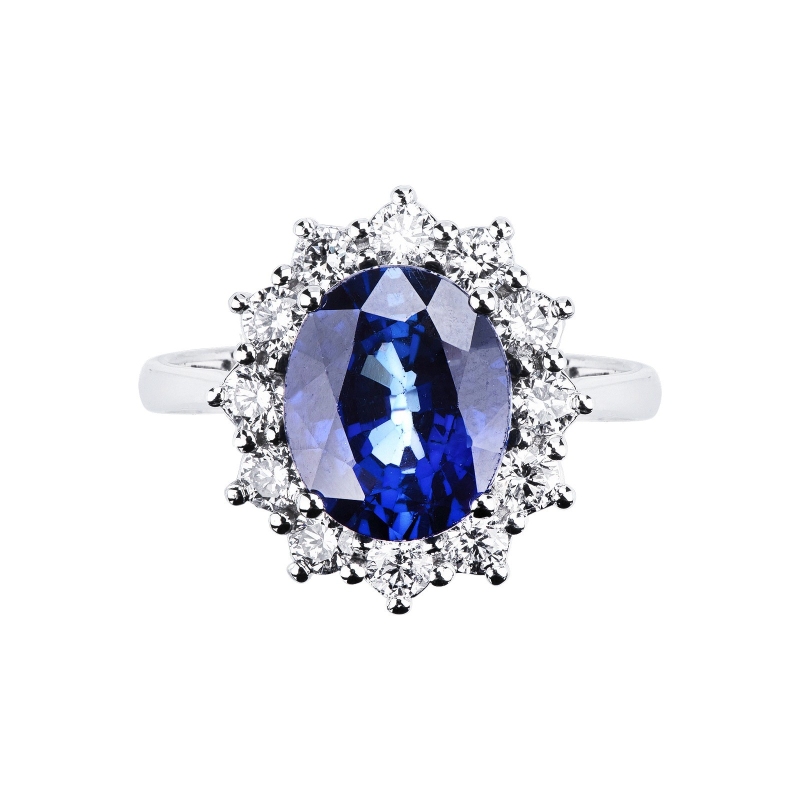 White gold 18k halo ring with blue sapphire and diamonds 