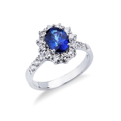 White gold 18k halo ring with blue sapphire and diamond shoulder set 