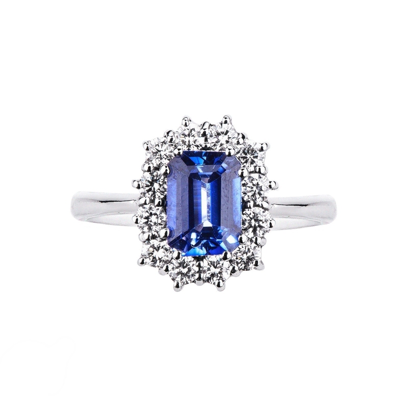 White gold 18k halo ring with diamonds and a central blue sapphire 