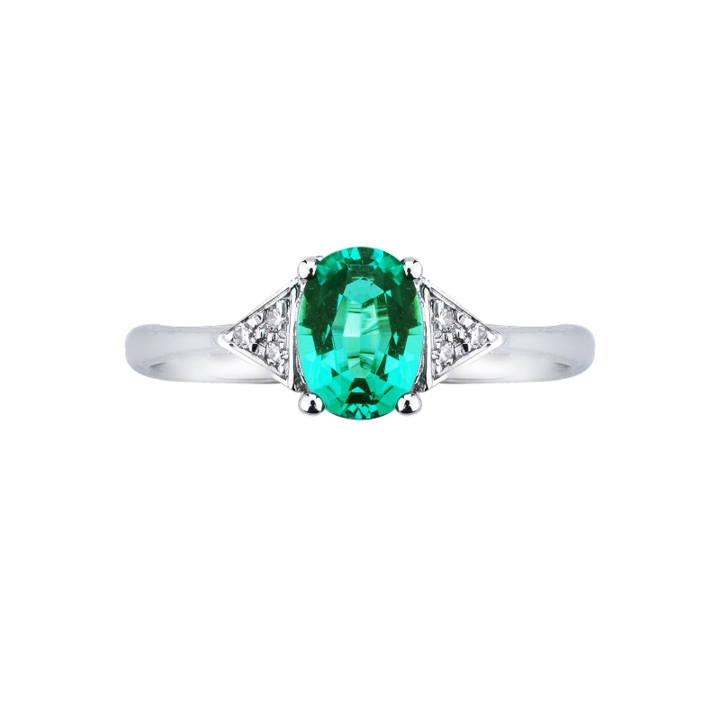 White gold 18k ring with emerald and three diamonds on each side 