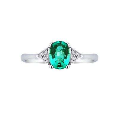 White gold 18k ring with emerald and three diamonds on each side 